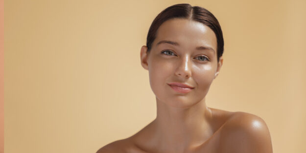 TheBestFacialForSummer Woman with Orange Background